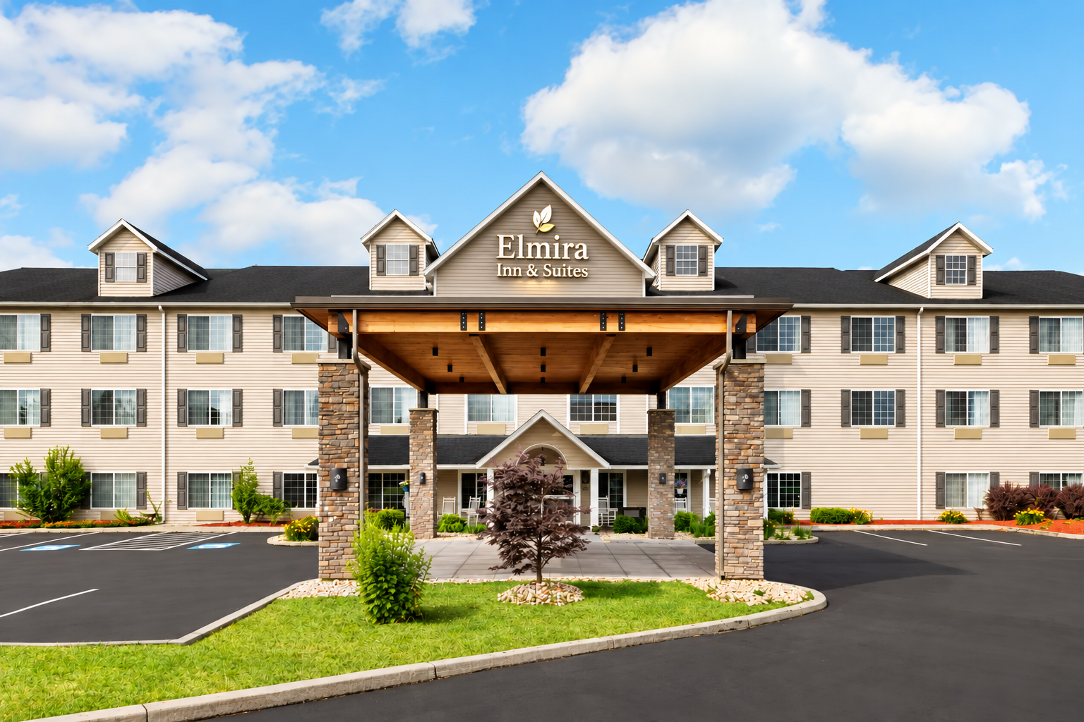 Front view of Elmira Inn and Suites entrance and porte-cochère