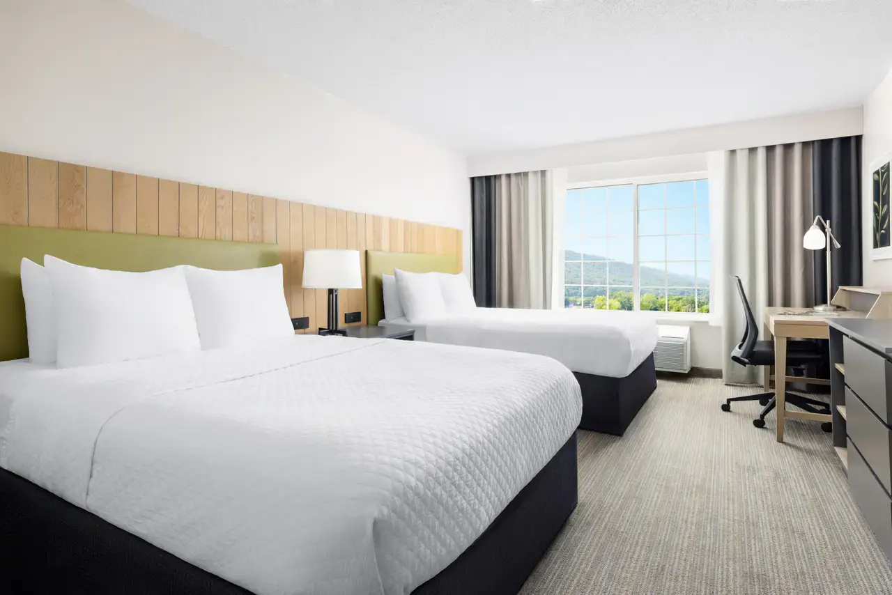 Elmira Inn and Suites Double Queen guest room with two queen beds